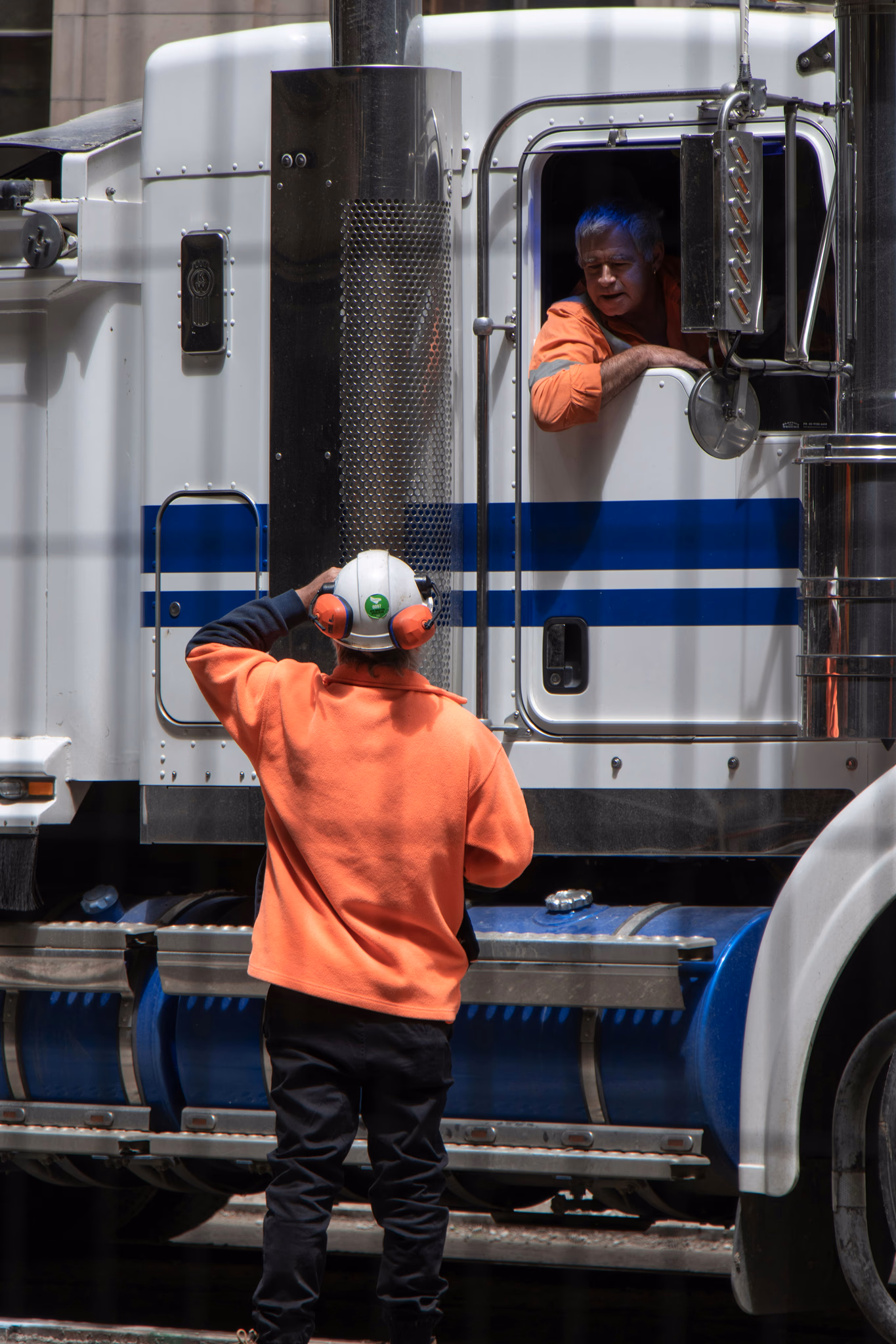 A technician working beside a freight truck
