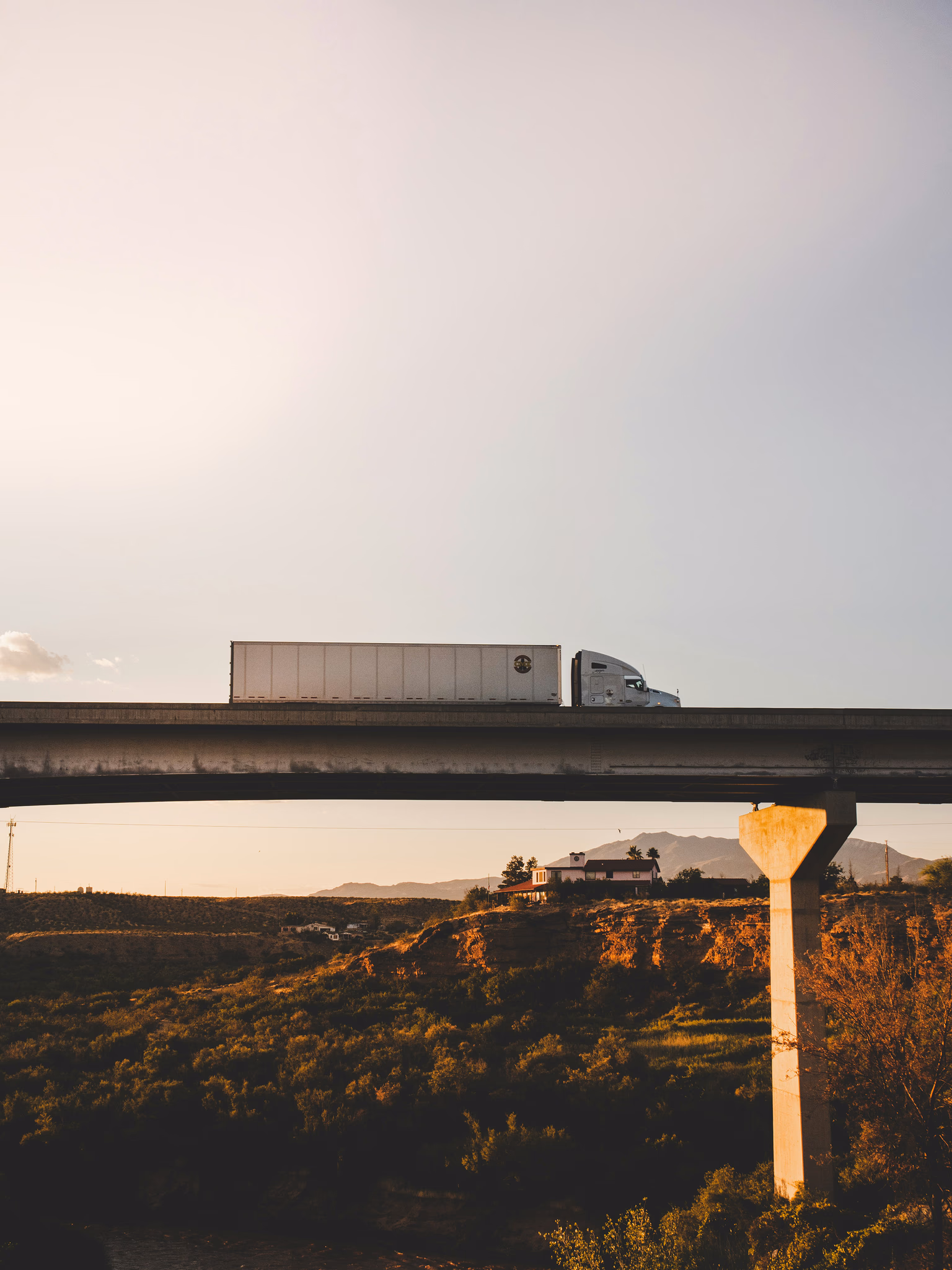 Freight truck crossing a concrete bridge